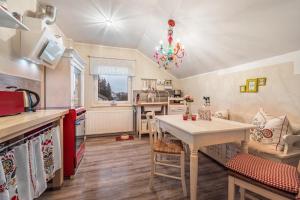 a kitchen with a table and a dining room at Ferienwohnung Solling-Lounge in Holzminden