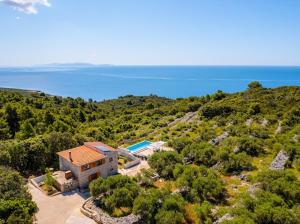 an aerial view of a house with the ocean in the background at Stone oasis Marin in Žrnovo