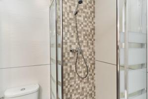 a shower in a bathroom with a glass shower backdoor at Nerja Boutique 103 Sweet Corner in Nerja +16 photos