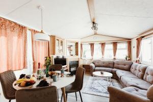 a living room with a couch and a table at Villa Hexengericht in Thale
