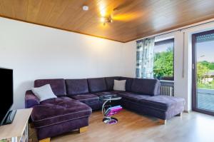a living room with a couch and a table at Fribo in Ostrach