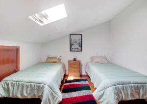 a bedroom with two beds and a dresser at Villa com 4 apartamentos in Apúlia +34 photos