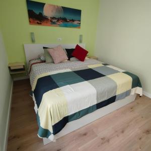 a bedroom with a bed with pillows on it at Apartamento Joya in Puerto Rico de Gran Canaria +15 photos