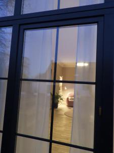 a view of a room through a glass door at am Conradhof in Goch