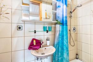 a bathroom with a sink and a shower at Haus Strohmeier in Brandenberg +18 photos
