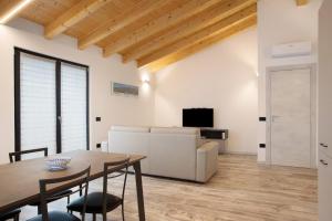 a living room with a table and a couch at Appartamento Alice in Caiolo