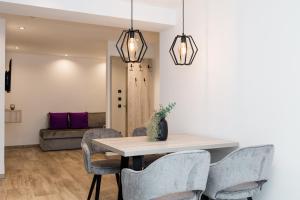 a dining room with a table and chairs at Grauzone Grossarl App Nr 1 Cozy in Grossarl +20 photos