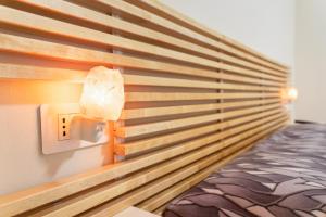 a room with a bed and a switch on a wall at Villa Giovia in Guspini +37 photos