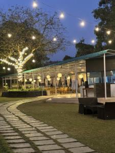 a building with lights on it at night at Hiranya Nature Retreat in Daulatābād