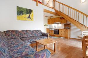 a living room with a couch and a table at Haus Albatros Wohnung 4 in Koserow
