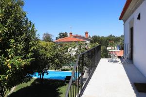 a external view of a house with a swimming pool at Casa do Mestre Inteira in Vila de Punhe