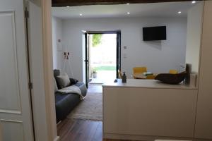 a living room with a couch and a table at Casa do Mestre Inteira in Vila de Punhe