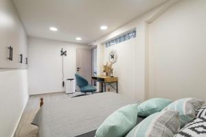 a bedroom with a bed and a desk at Villa Andreas in Athani