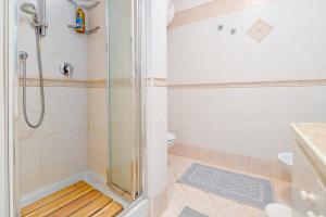 a bathroom with a shower and a toilet at Casa Ioana in Cugnana Verde +15 photos