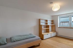 a bedroom with a bed and a book shelf at Haus Elisabeth in Lauf