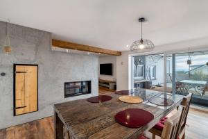a dining room with a table and a fireplace at Haus Elisabeth in Lauf