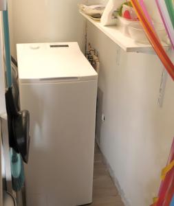a small refrigerator in a kitchen with a counter at Gîte Le Penn-ty in Rosporden +20 photos