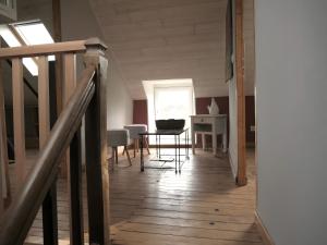 a hallway with a table and a dining room at Gîte Le Penn-ty in Rosporden