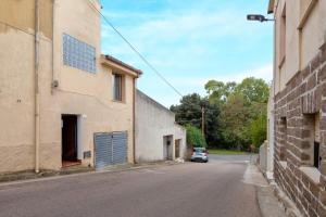 a car parked on a street next to a building at Casa Belvedere in Codrongianos