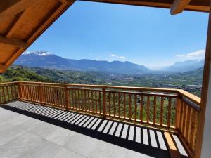 a balcony with a view of the mountains at Unterötzbauerhof - Fewo Rosenblick in Tirolo +15 photos