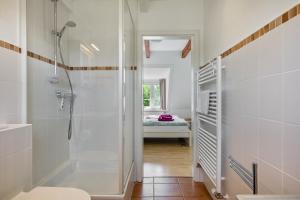 a bathroom with a shower and a walk in shower at Fewo Silbermöwe in Pellworm +21 photos