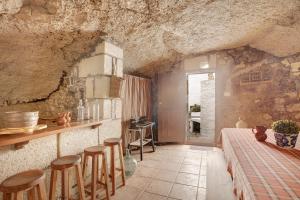 a room with a bed and some stools in it at Casa Rural Madre Nieves in Fasnia