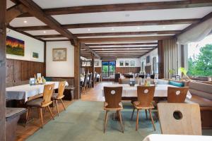 a restaurant with a long table and chairs at Haus Tannenberg in Todtnau