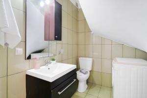a small bathroom with a sink and a toilet at Villa prolithia 1 in Vlikhón +23 photos