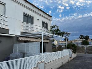 a balcony of a white building with a fence at Rodalia in El Verger