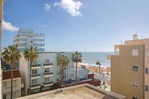 a view of the beach from a hotel condominium at Abertura Mar Zen in Quarteira