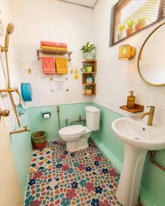 a bathroom with a toilet and a sink at Hug Pai Garden City Retreat in Pai +57 photos