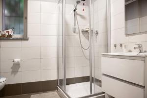 a bathroom with a shower and a sink at Il sole di calde Lago maggiore 504 in Castelveccana +12 photos
