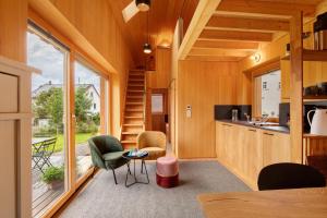 a kitchen and living room in a tiny house at Tinyhaus am Bussen in Unlingen