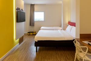 TV a/nebo společenská místnost v ubytování ibis Styles Birigui