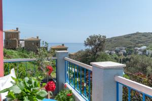 a balcony of a house with a view of the ocean at Stenies'nook in Andros