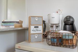 a kitchen counter with a blender and a basket on it at Stenies'nook in Andros +15 photos