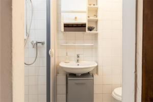 a bathroom with a sink and a shower at Casa Al Cantone in Certaldo +18 photos