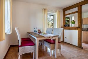 a dining room with a table and chairs at Hof Verchen Nahe Kummerower See in Verchen