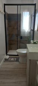 a bathroom with a shower with a toilet and a sink at Casacamer S in Sagunto +29 photos