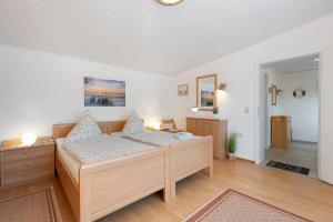 a bedroom with a bed in a room at Ferienwohnung Landhaus Loose in Schashagen