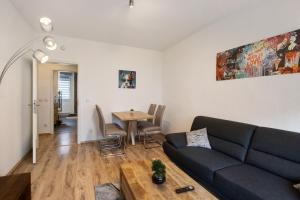 a living room with a couch and a table at Ferienwohnung San Marino 2 in Mücheln