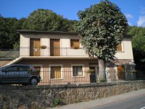 a truck parked in front of a house at Gite La Combe de Melvieu in Viala-du-Tarn