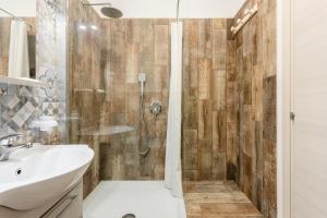 a bathroom with a shower and a sink at Casavacanzefranca - 14 in Terrasini
