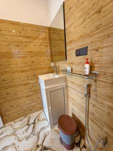 a bathroom with a toilet and a sink at Astral Zone Cottage Scenic Mountain view Stay Ella in Ella +80 photos