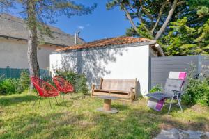 a group of chairs and a bench in a yard at La Baule in La Baule +12 photos