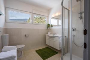 a bathroom with a toilet and a sink and a shower at Apartment Sciadules in Ortisei +27 photos