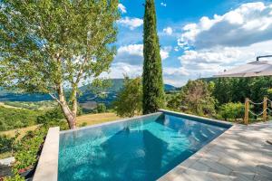 a swimming pool in a villa with a view at Assisi Countryhouse in Assisi