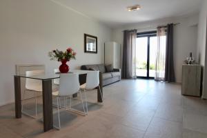 a living room with a table and chairs and a couch at Amazing Assisi in Assisi