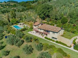 an aerial view of a house with a swimming pool at Amazing Assisi in Assisi