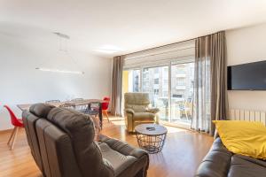 a living room with a couch and a table at Apartamento Palomera Blanes in Blanes